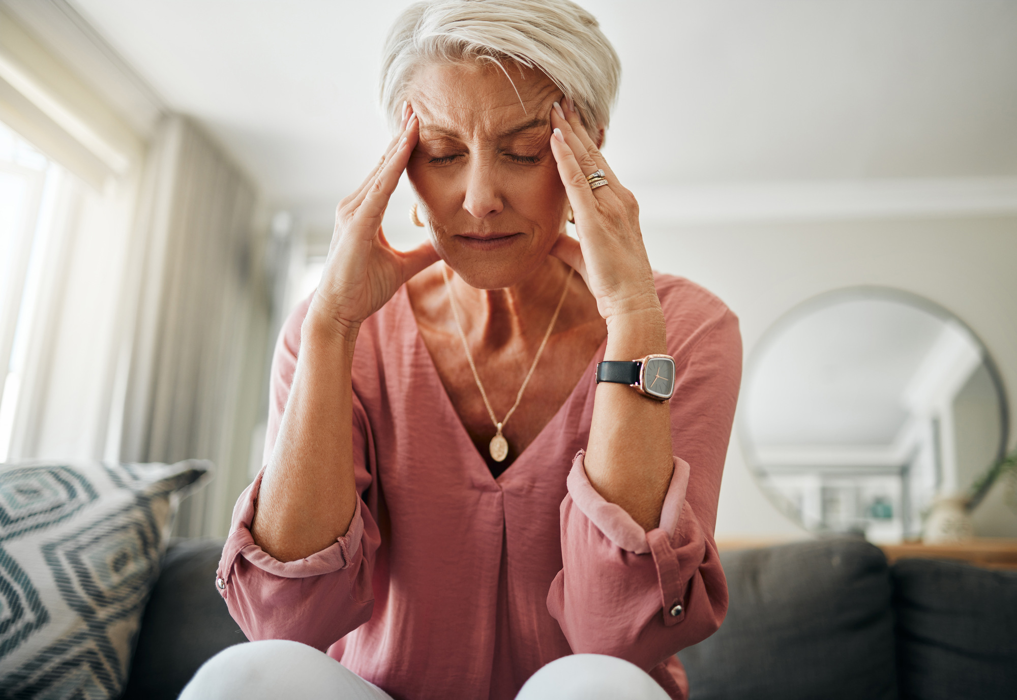 A senior woman having a headache