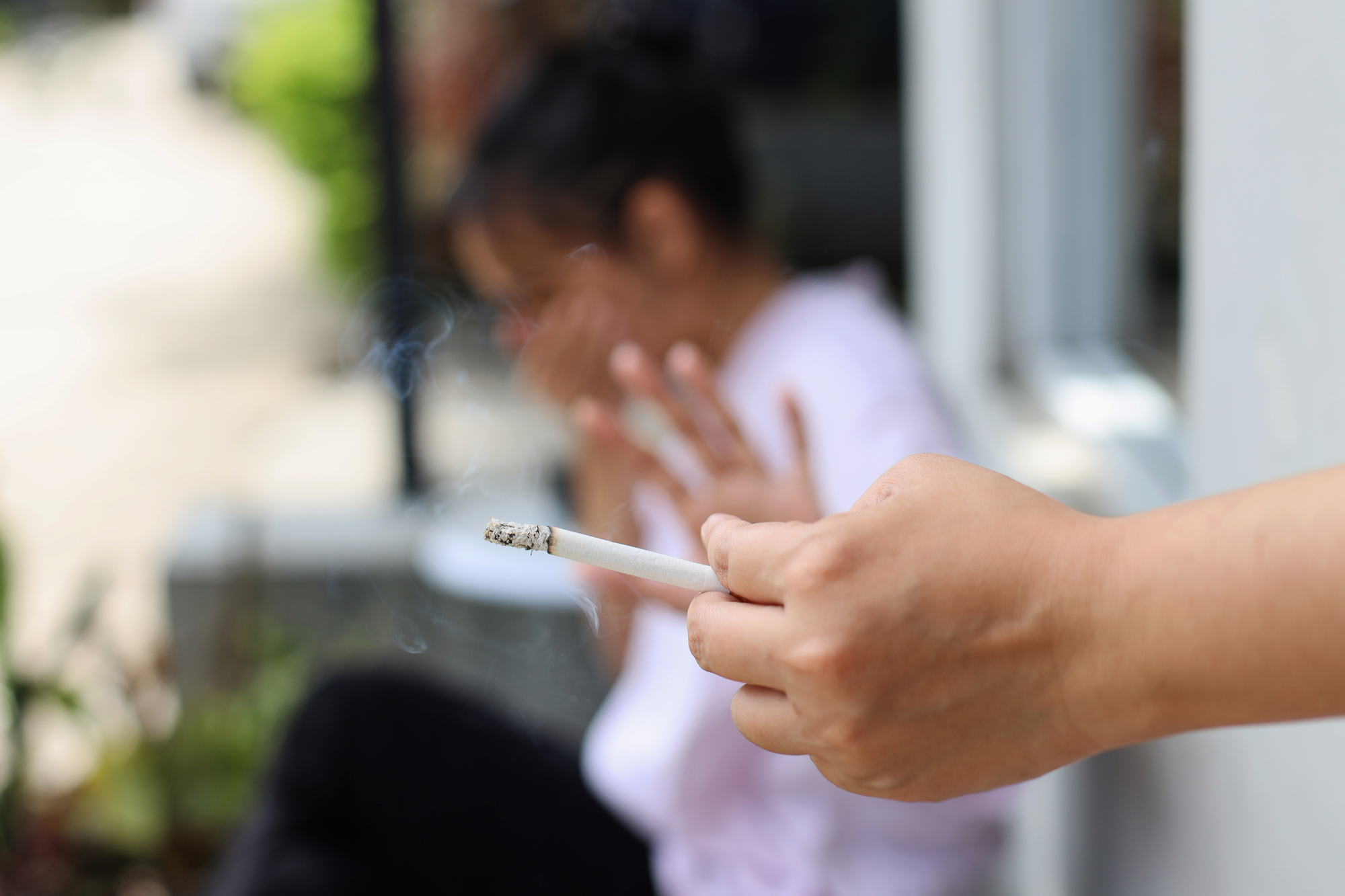 A person refusing to smoke a cigarette